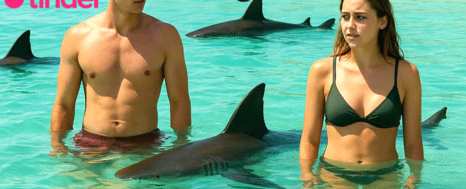 A concerned man and woman stand apart in waist-deep tropical water, surrounded by three ominous shark fins, symbolizing the hidden dangers of dating apps used to target and kidnap Americans in Mexico.